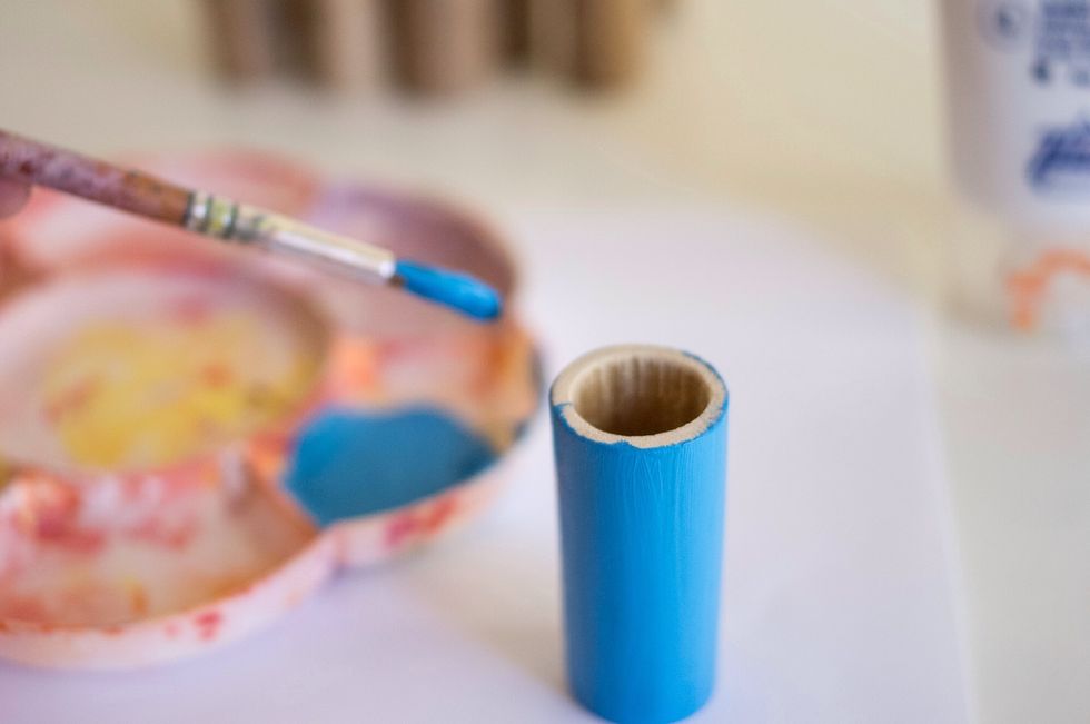 Start painting the tubes. Let them dry, and then apply the second coat.