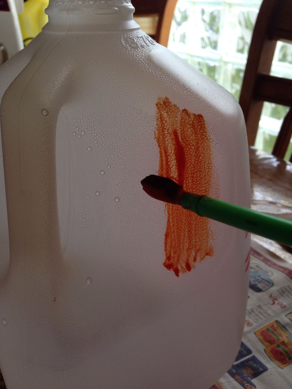 Start painting your jug orange.
