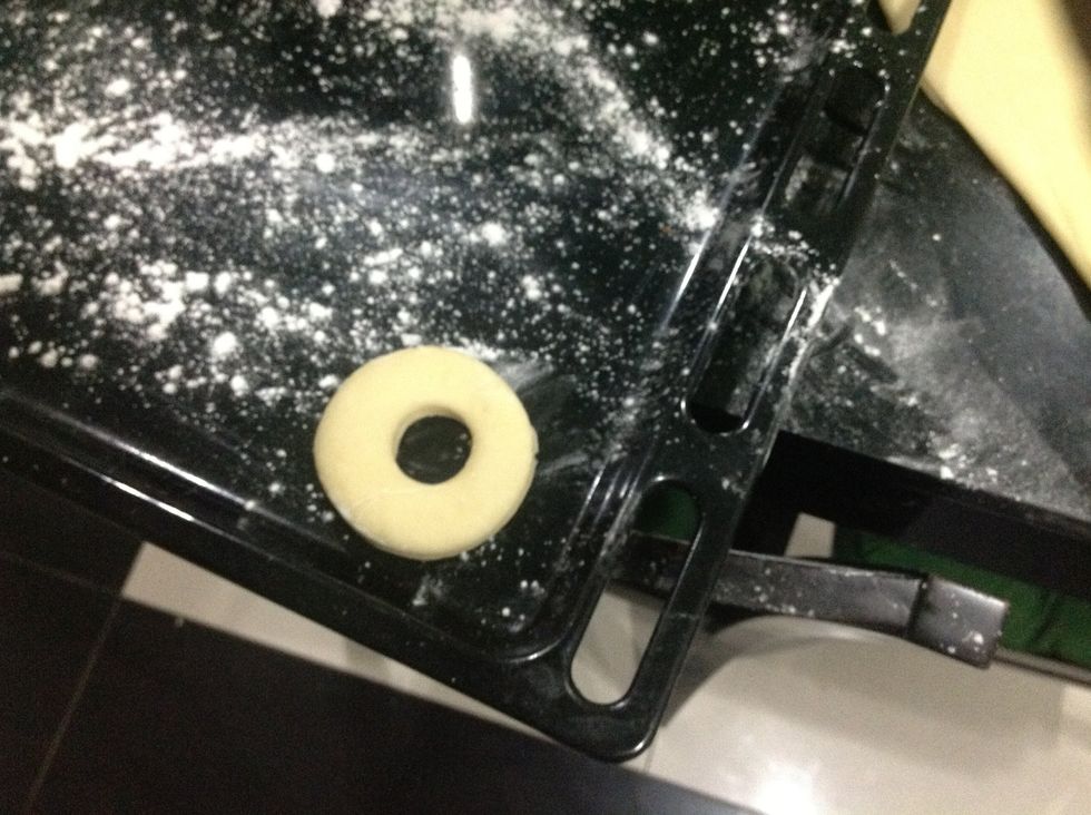 Start placing it onto the floured baking sheet.