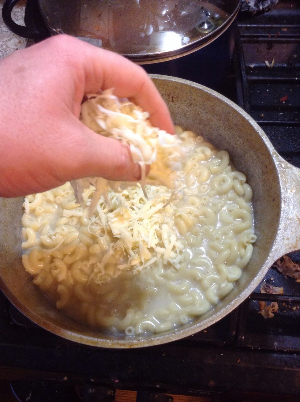 Start placing your 5 pounds of cheese on top of your carb soup!