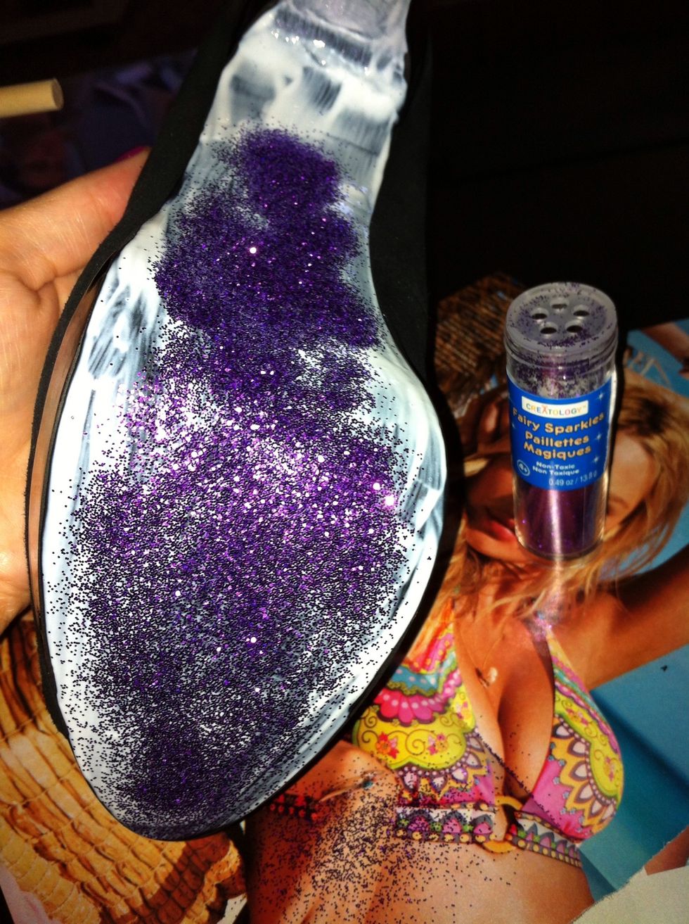 Start pouring glitter on. Have pages from magazines to catch the loose glitter so you can re-pour it. Cover the bottoms completely.