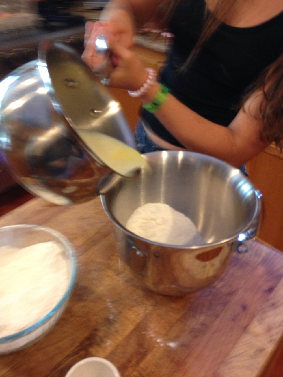 Start pouring, mixing together the milk and flour. Alternate between the batters finishing with the flour.
