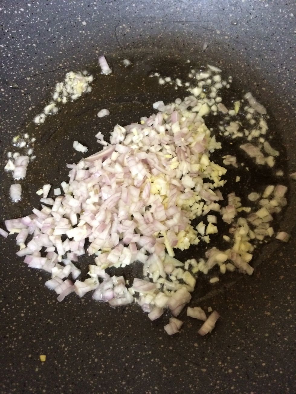 Start putting in the onion and garlic into the frying pan