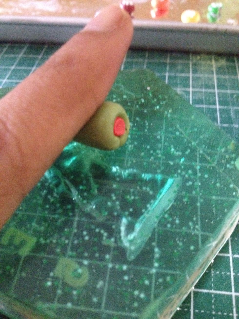 Start rolling the cylinder in the centre to the edges.