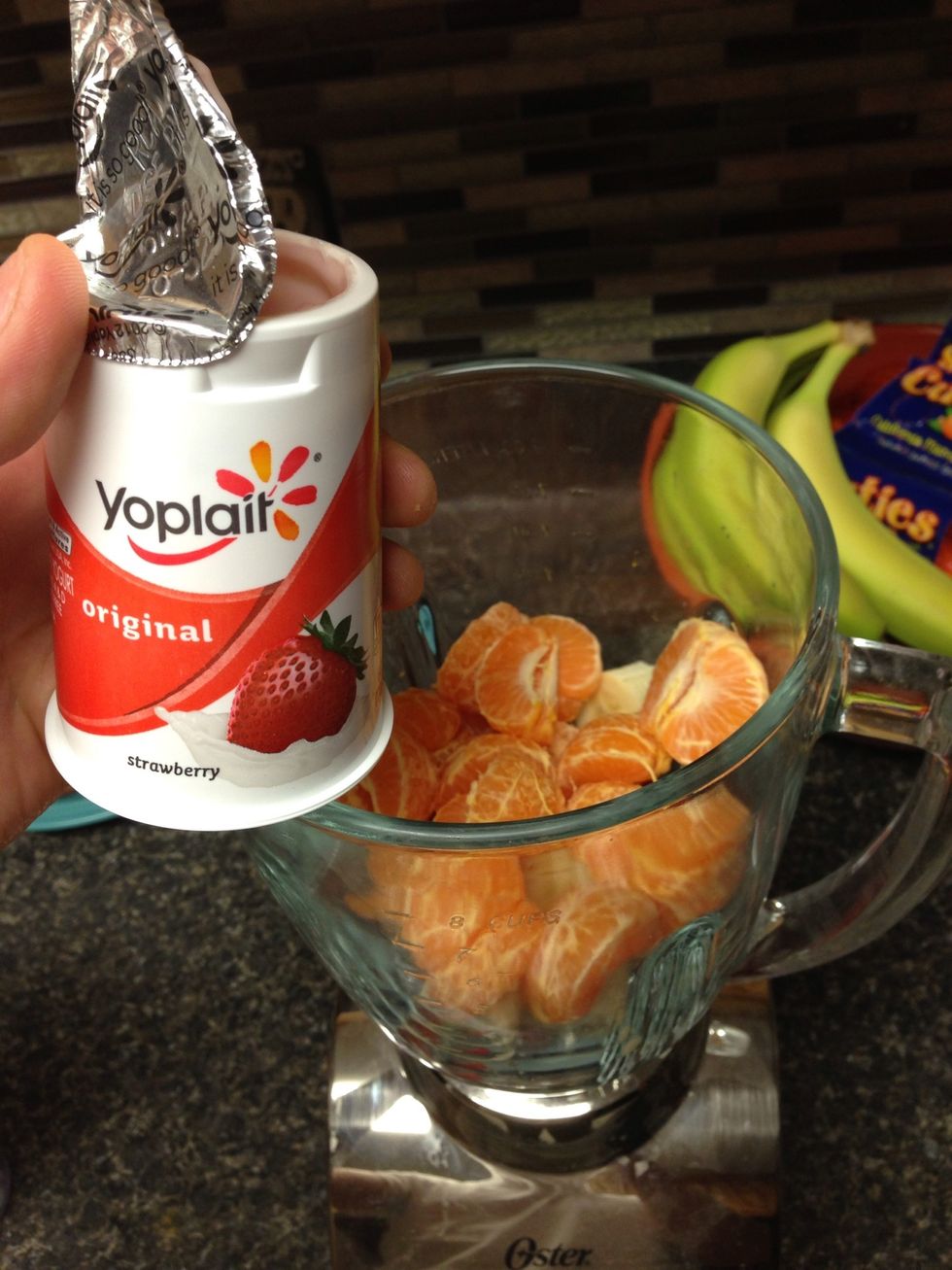 Start scooping your yogurt into your mix. Don't forget to lick the lids! P.S. you can choose whatever flavor you want, I like strawberry and strawberry/banana.