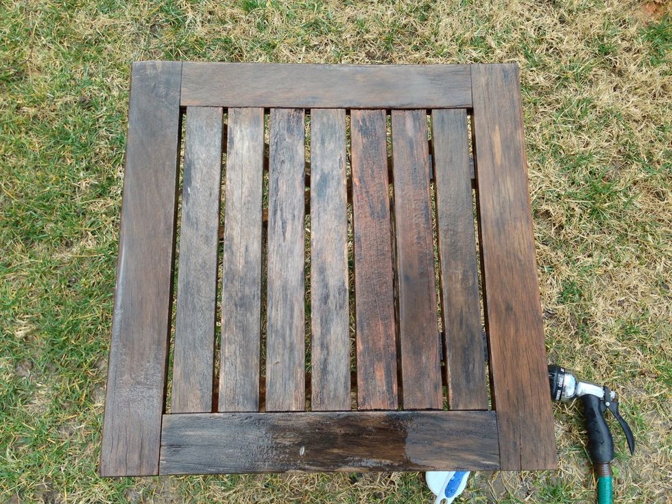 Start scrubbing with bristle brush.  This is half done in picture.  Rinse black gunk off.