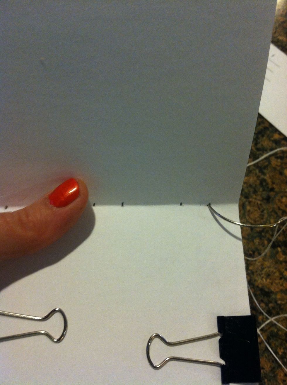 Start sewing, push needle through the first station on right