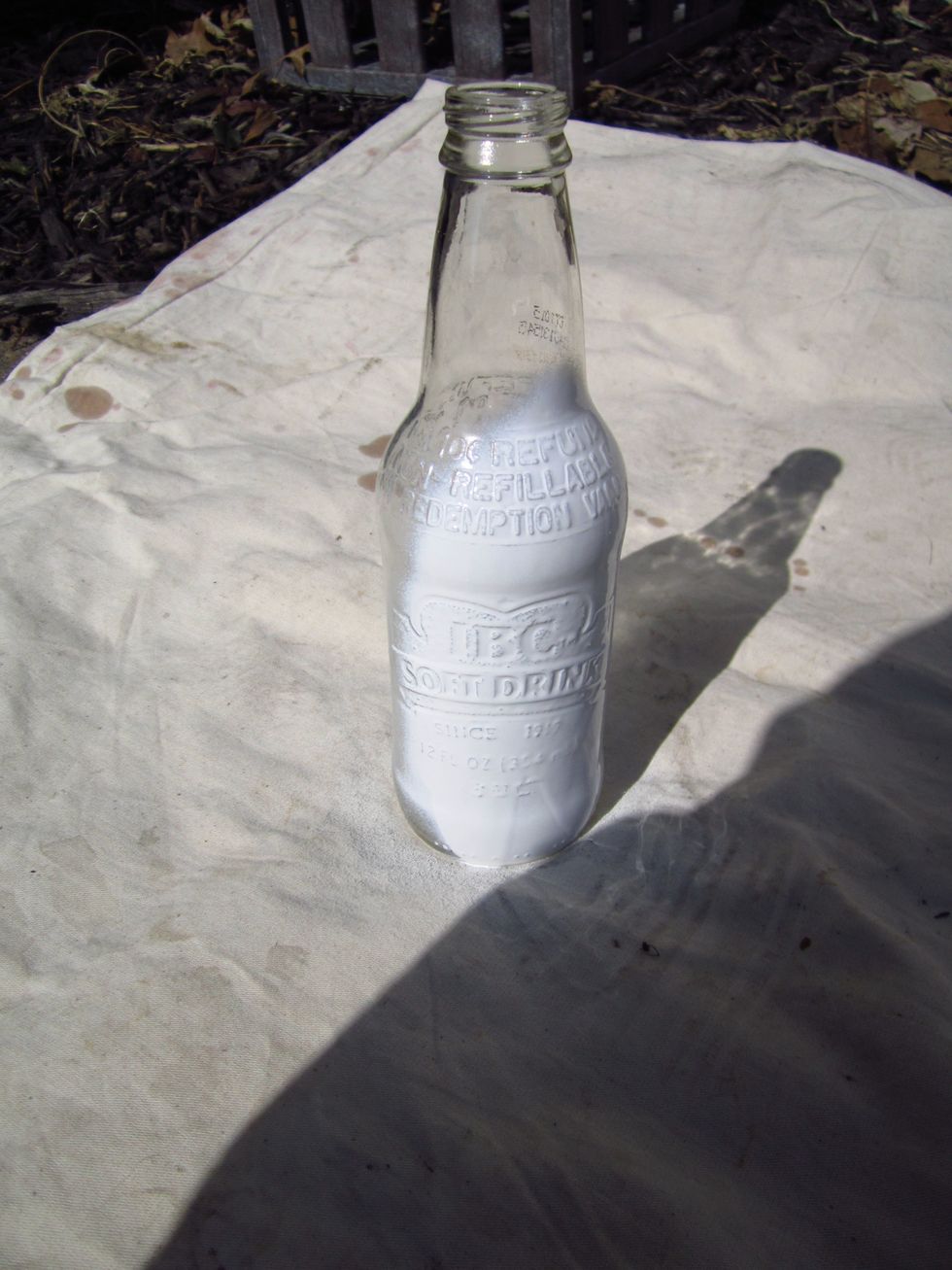 Start spraying your bottle. Make sure the spray paint can is well shaken!