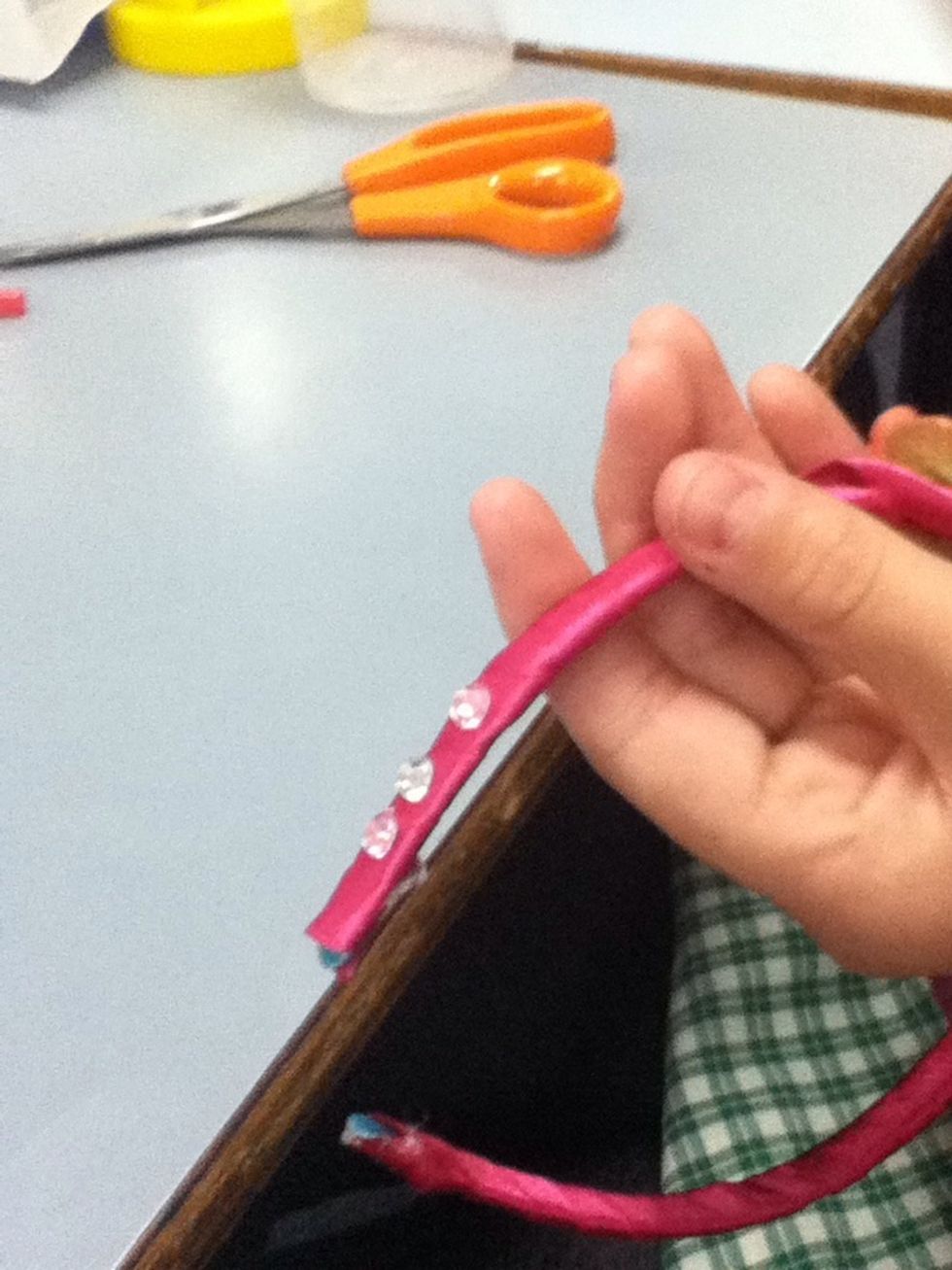 Start sticking jewels to headband