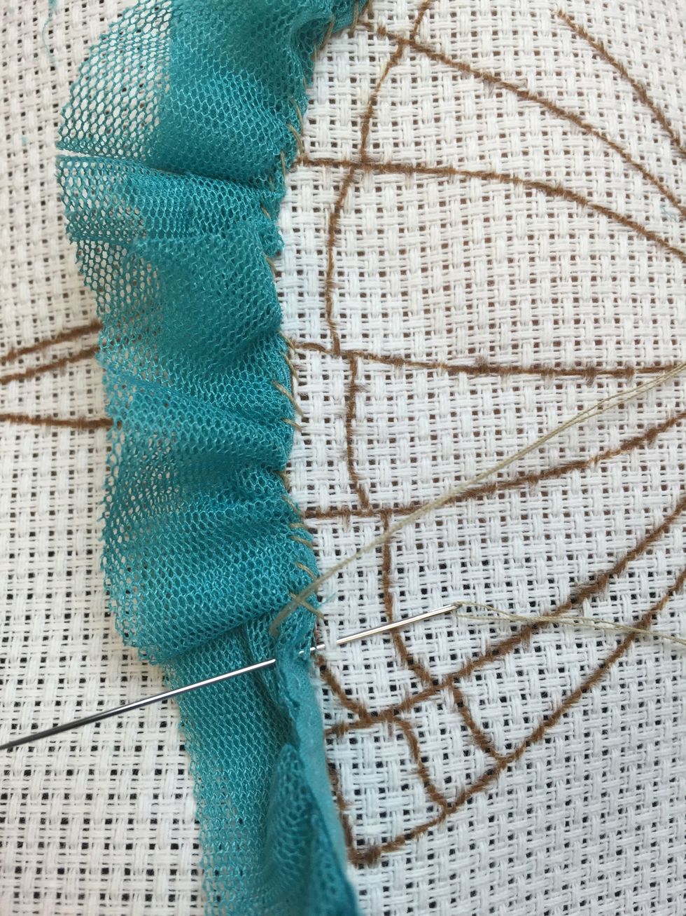 Start stitching your fabric to your base
