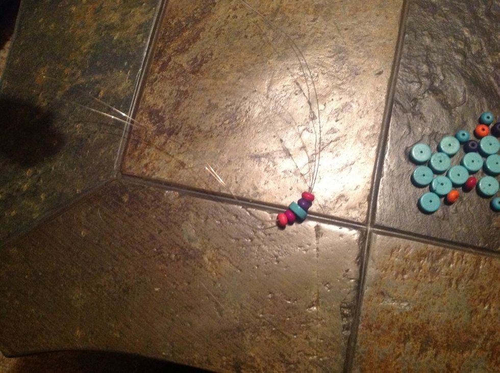 Start stringing beads onto the wire into the pattern of your choice.