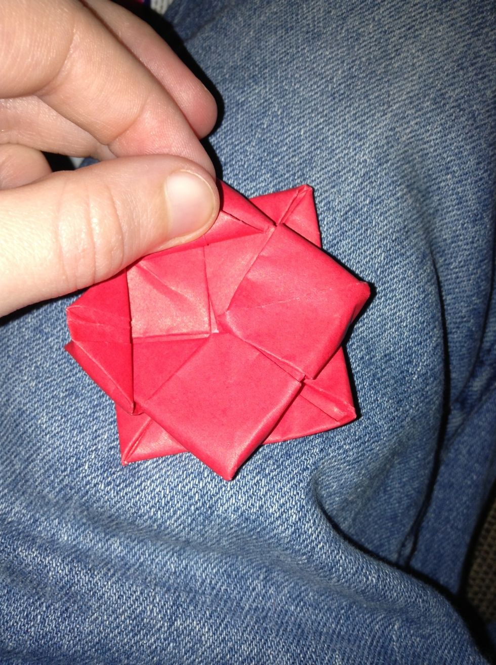 Start taking the corners and folding the all the way back to the edge