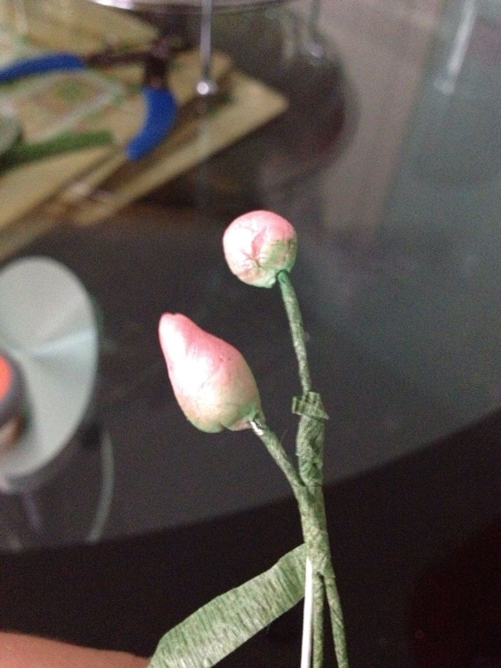 Start taping the buds onto the florists wire