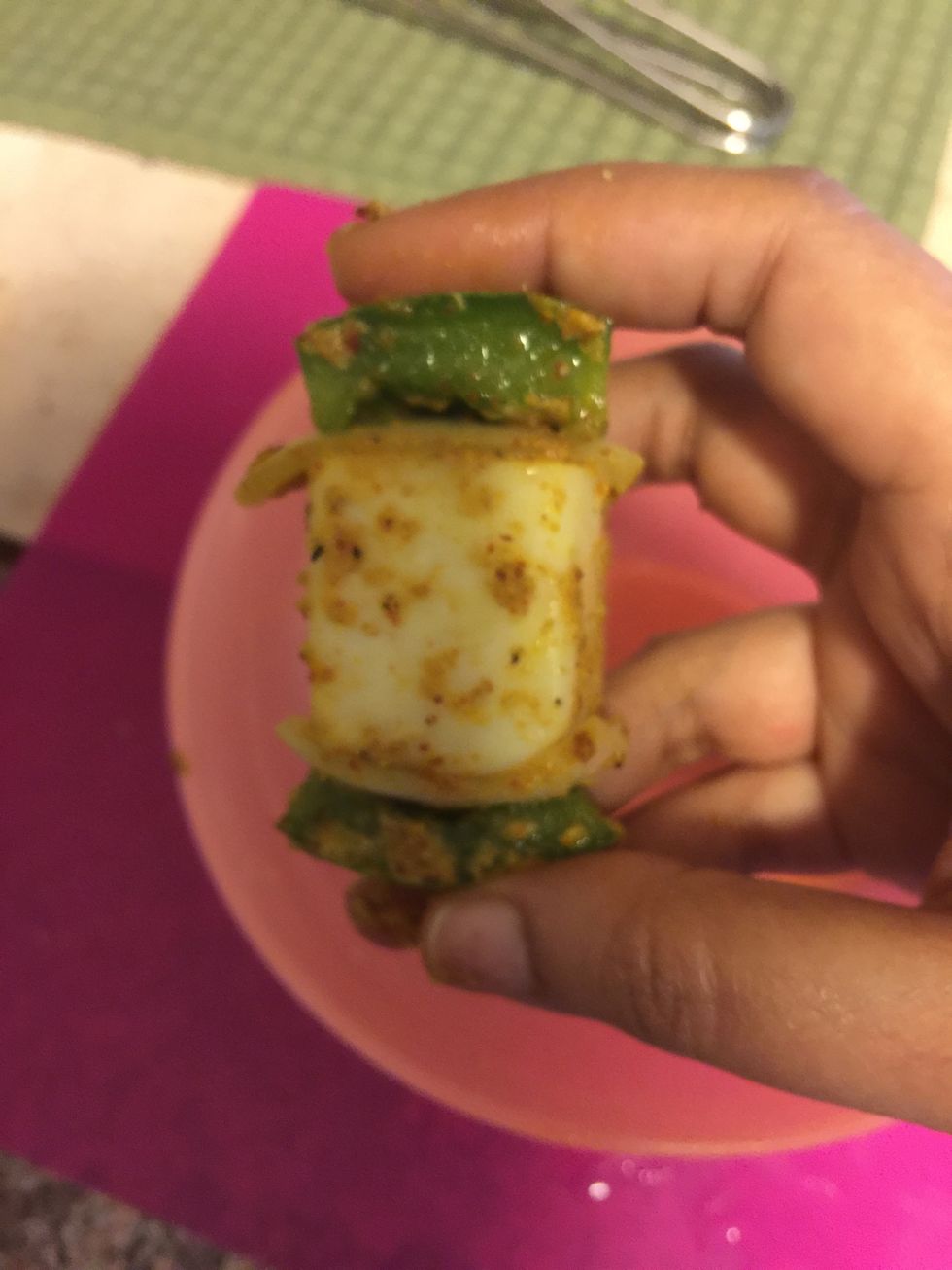 Start the assembly of tikkas. On a toothpick pierce one piece of capsicum, one piece onion, followed by one piece of paneer, one onion and one capsicum.