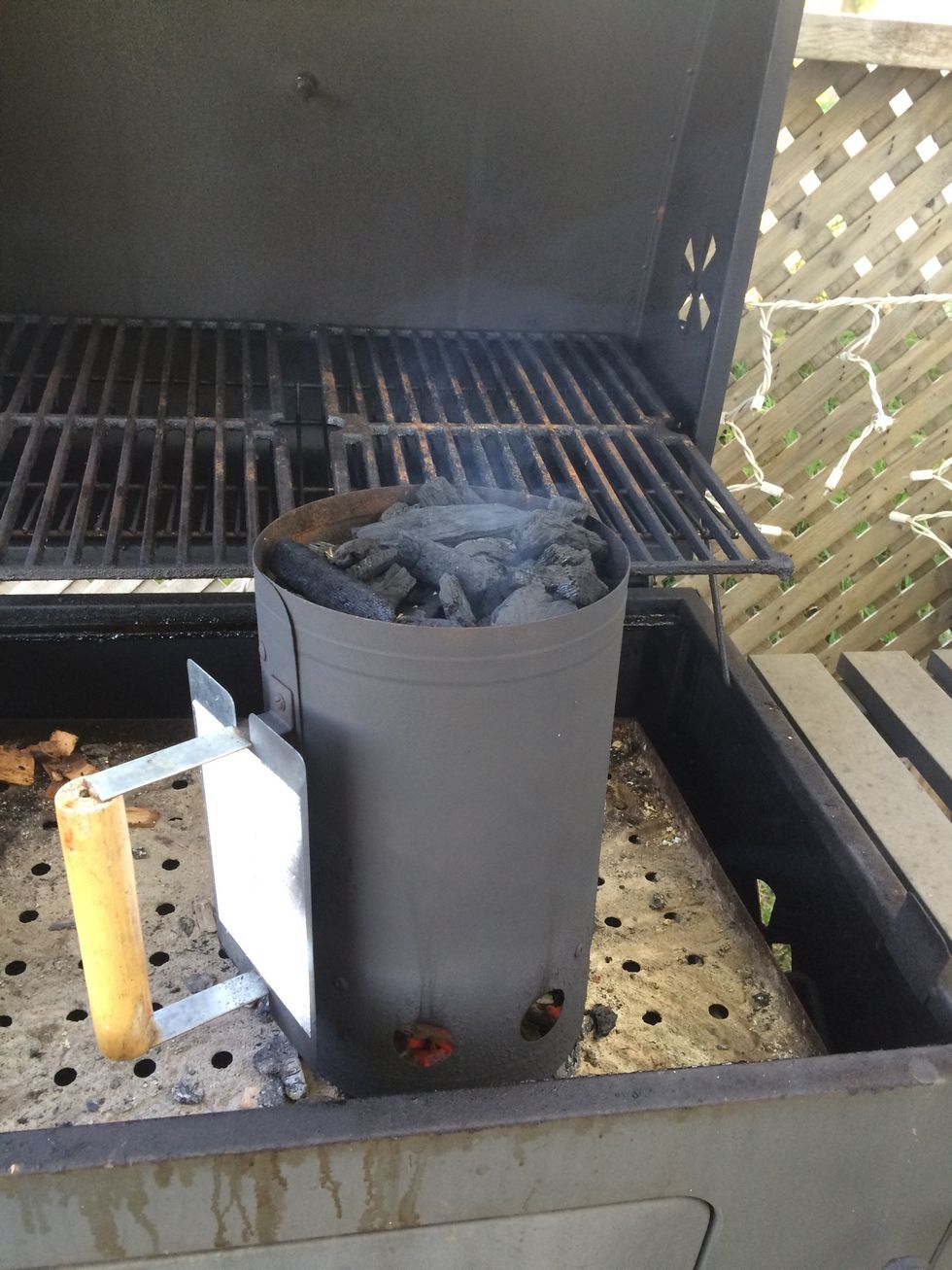 Start the BBQ. I use charcoal because it taste better than propane. Using a chimney starter is the only way to go to start my charcoal.