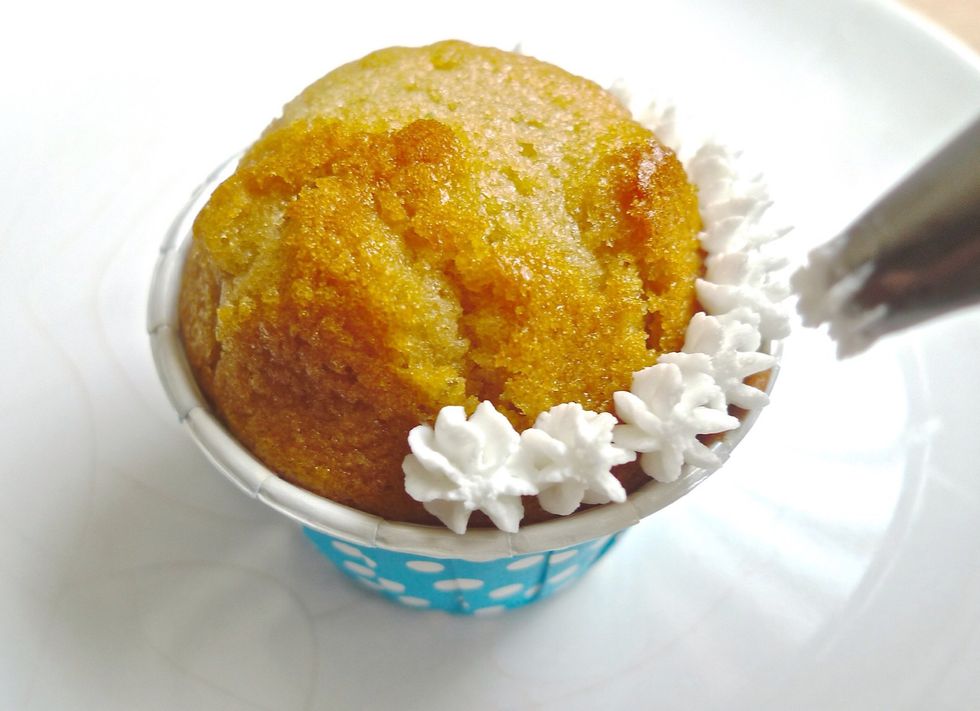 Start the frosting by making a simple design on the COMPLETELY cooled cupcake.