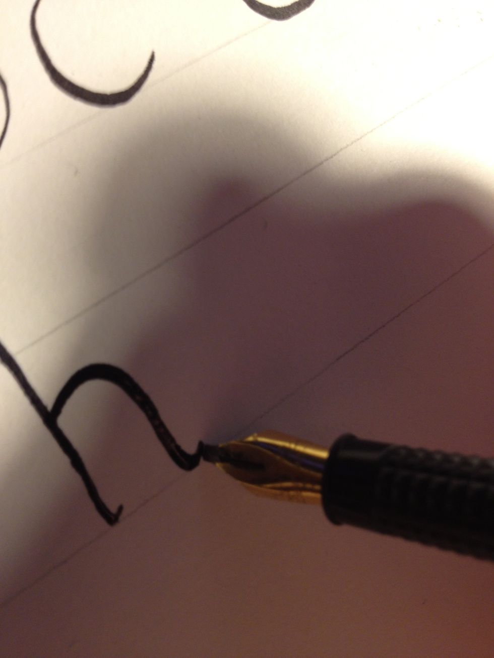Start the second stroke about a third of the way up the trunk, and complete the "h". Be sure to flare up at the end of the stroke, so the letter ends in a graceful thin line rather than a thick one.