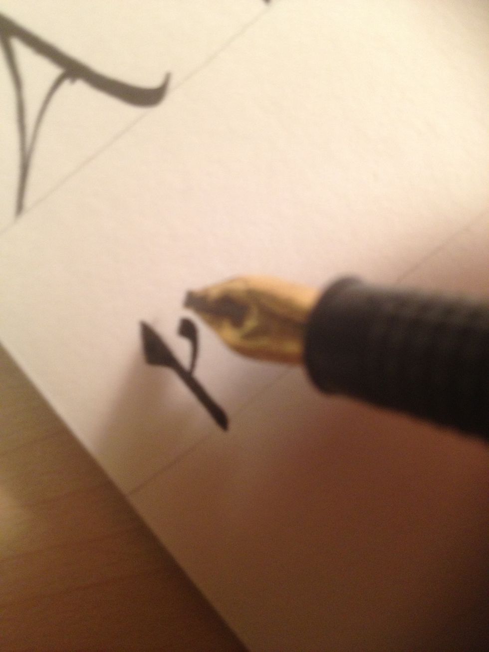 Start the second stroke about halfway up the trunk, flaring upwards at the end.