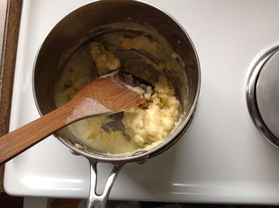 Start to add the warmed milk, a little at a time and stir