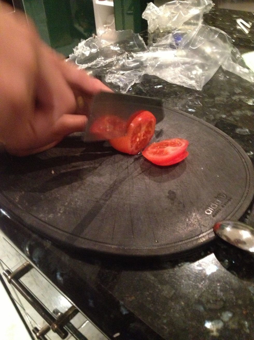 Start to chop up the tomatoes