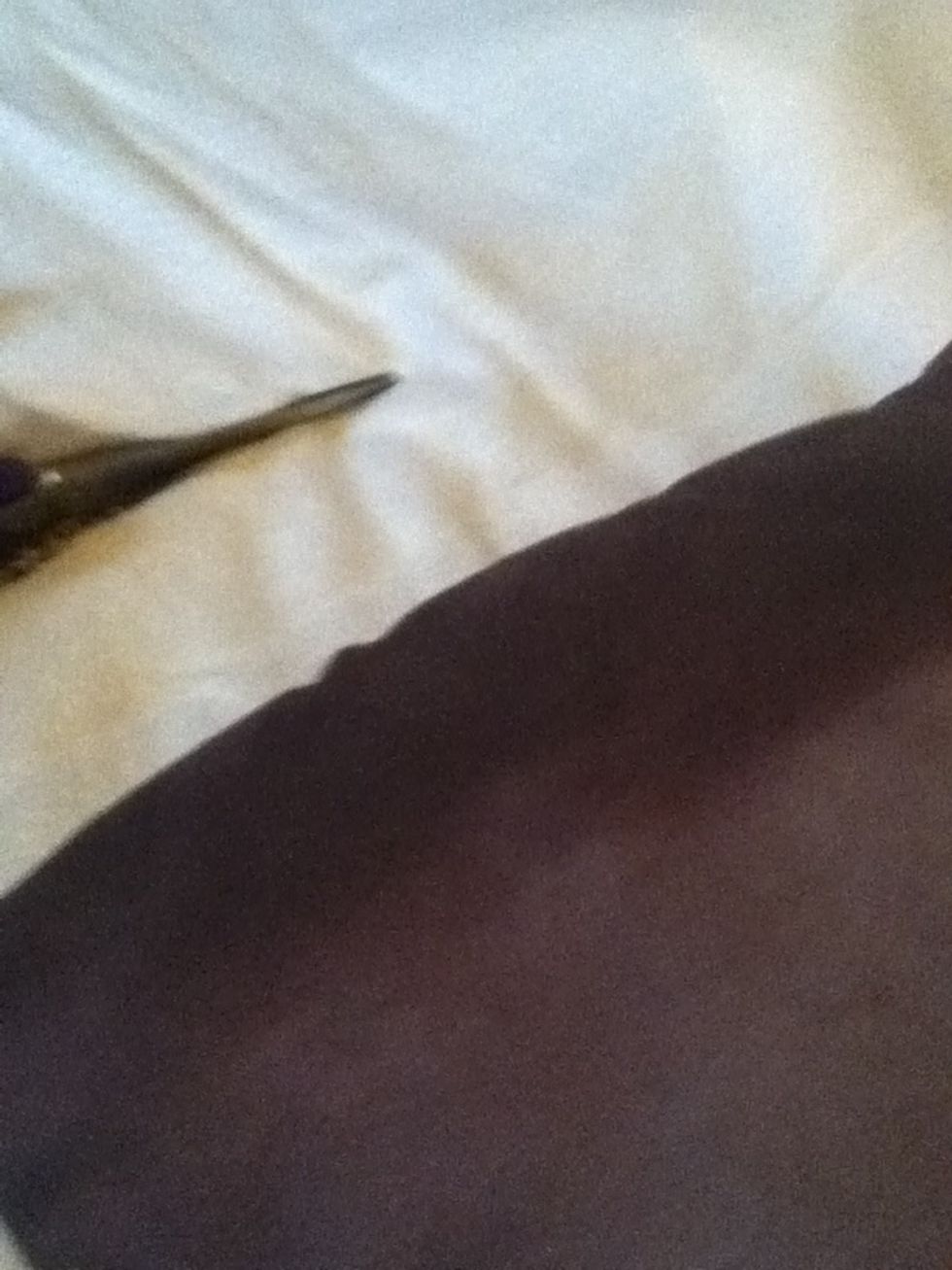 Start to cut around the pillow with and extra inch all around