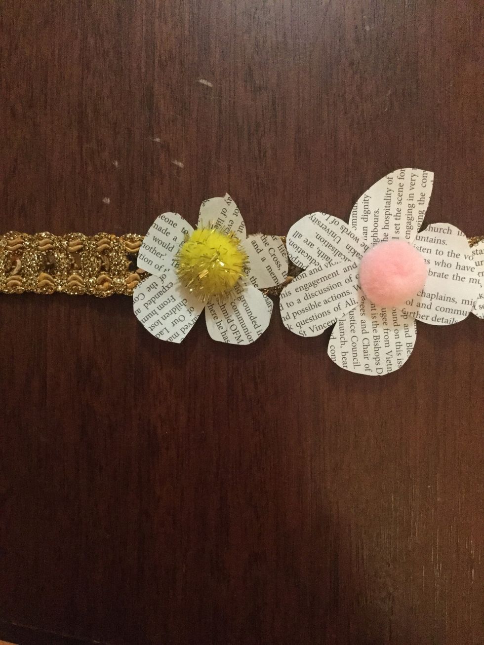 Start to glue the flowers on one by one.