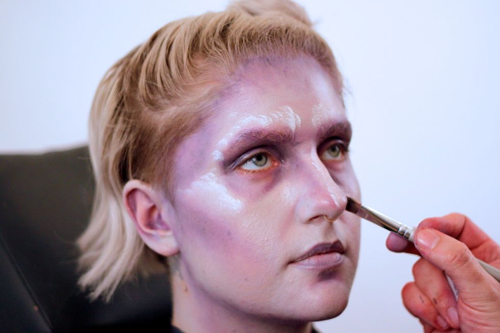 Start to highlight the highest points of the face with white. You're really trying to make the shadows look super deep.
