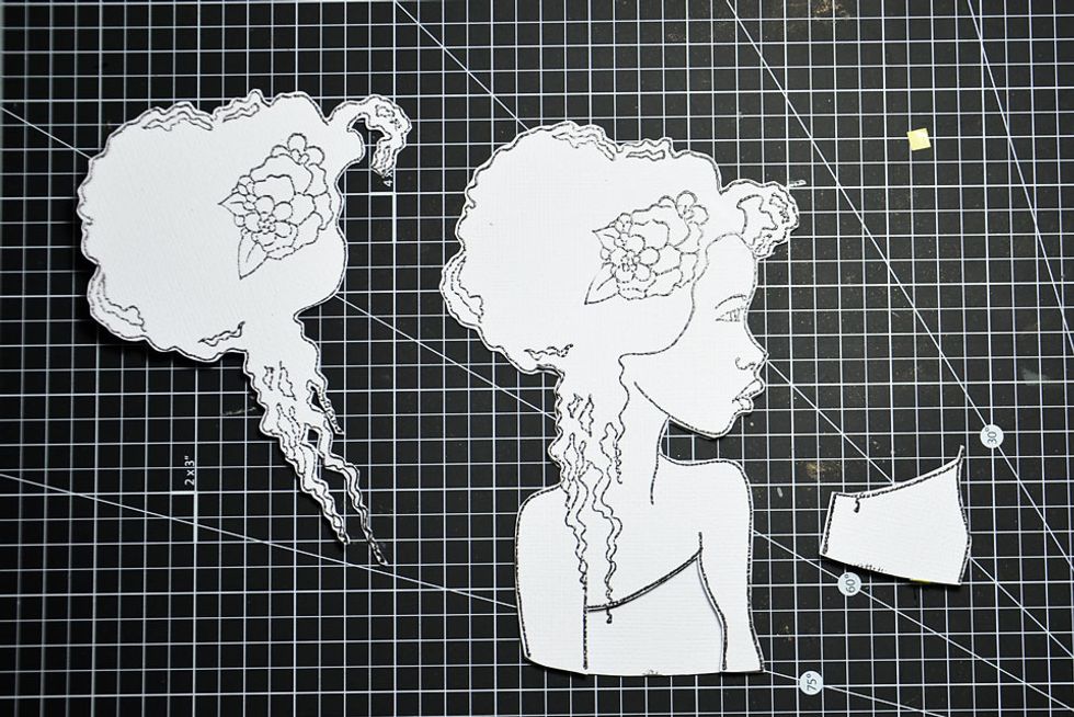 Start to layer the stamped images. The body and face image is the first layer.