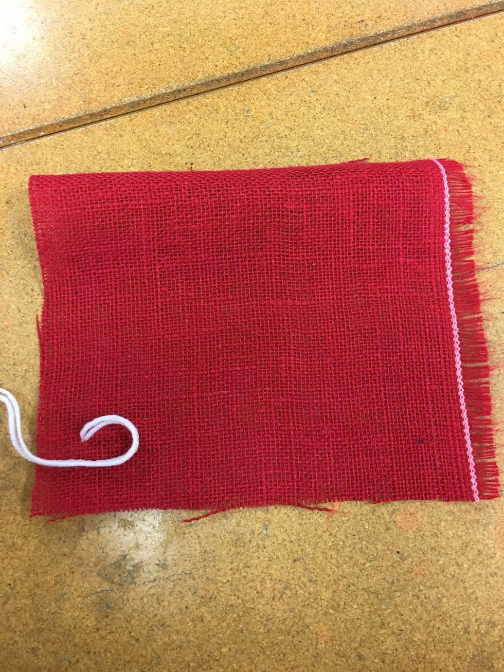 Start to make a curve with the yarn.