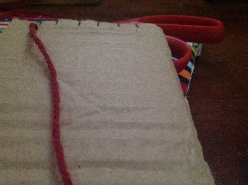 Start to slide yarn between cut Let yarn find opposite end to then wrap yarnthrough cut and around to start again at top continue until