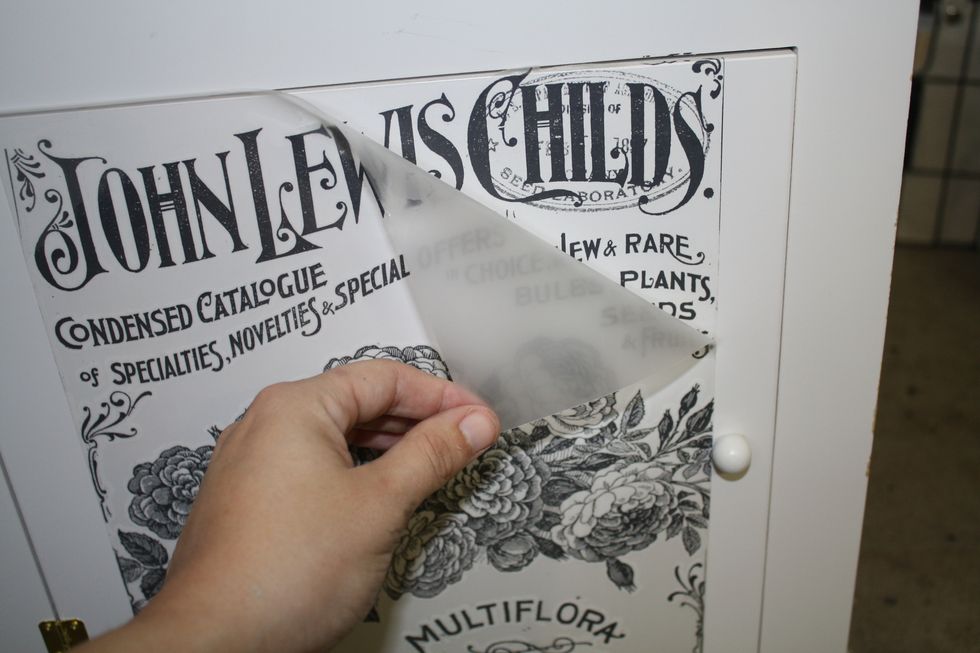 Start to slowly peel back the cover film from one corner. If you see any spots that didn't transfer just push the film back in place and rub more in that area. Mine went on perfectly!