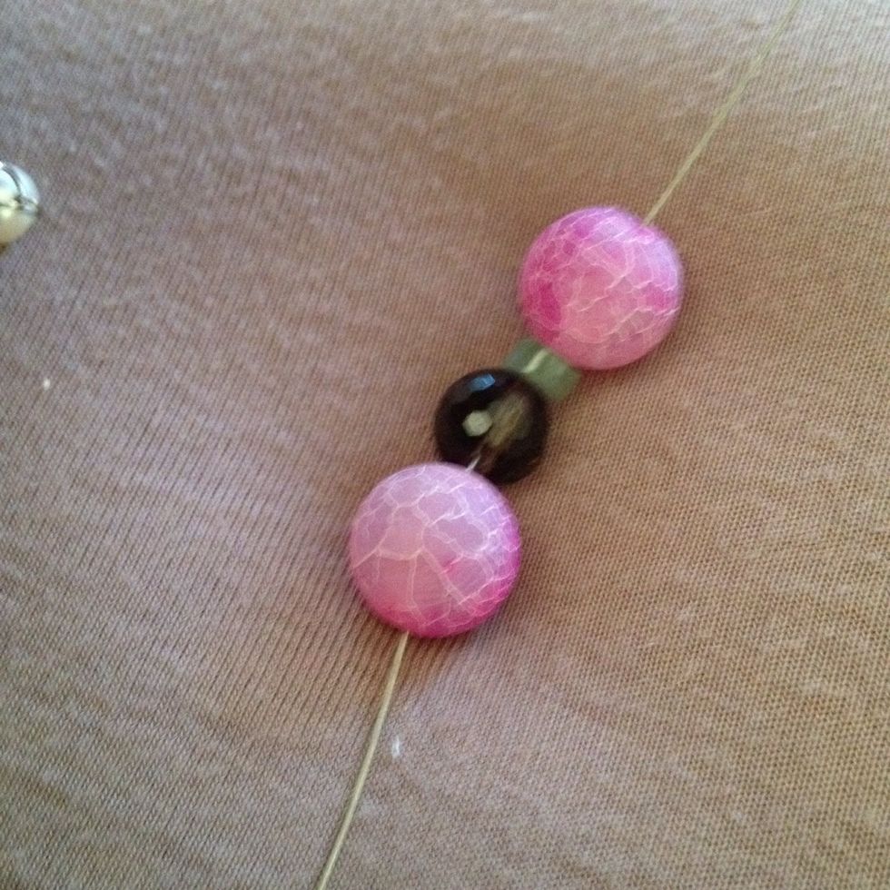 Start to thread your gemstones beads onto the wire.