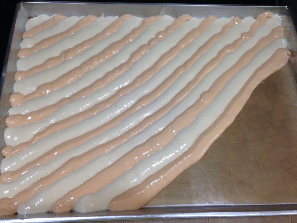 Start vanilla batter alternate with thai tea batter to end tray and then bake