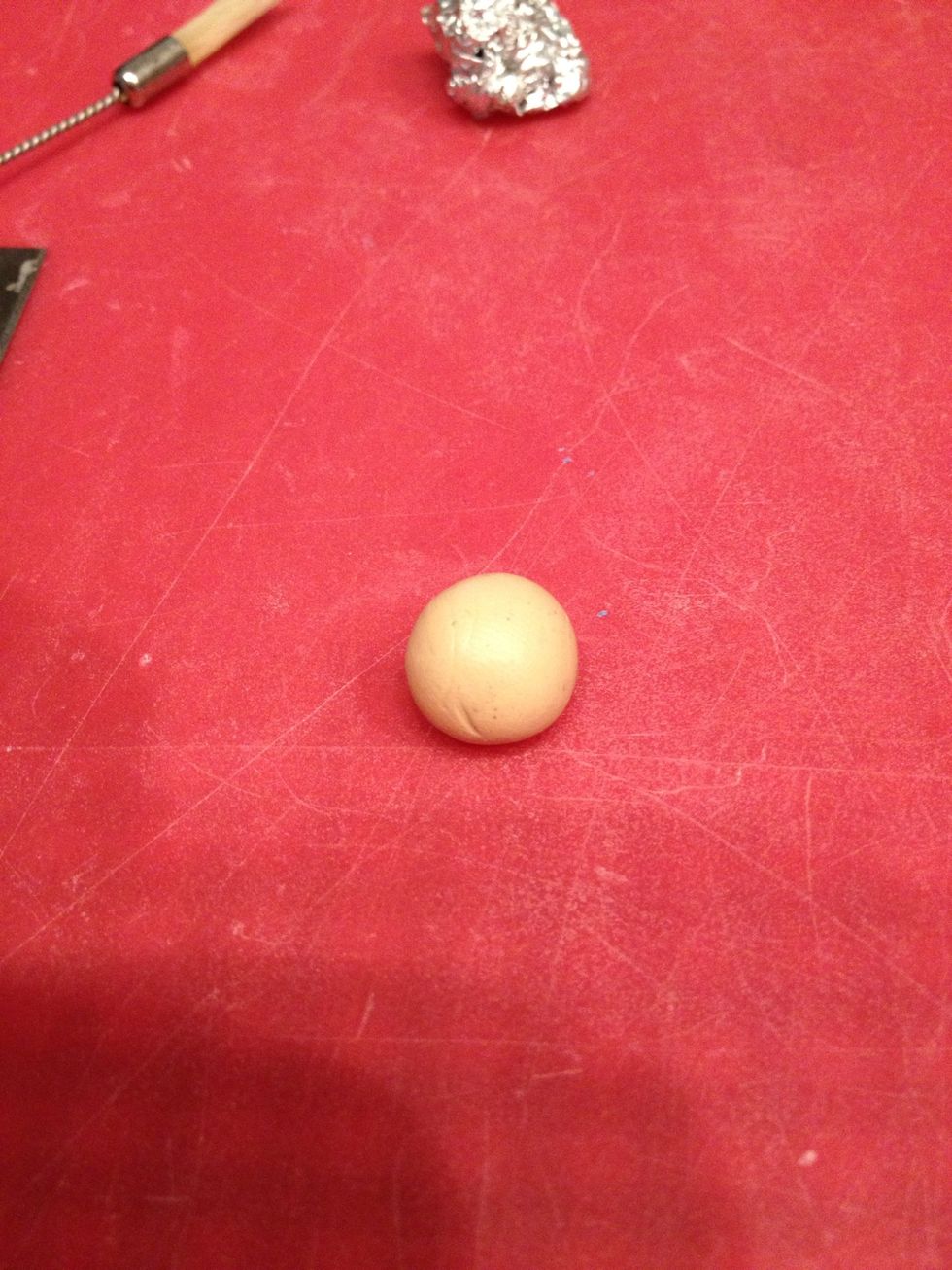 Start with a ball of tan/ecru polymer clay