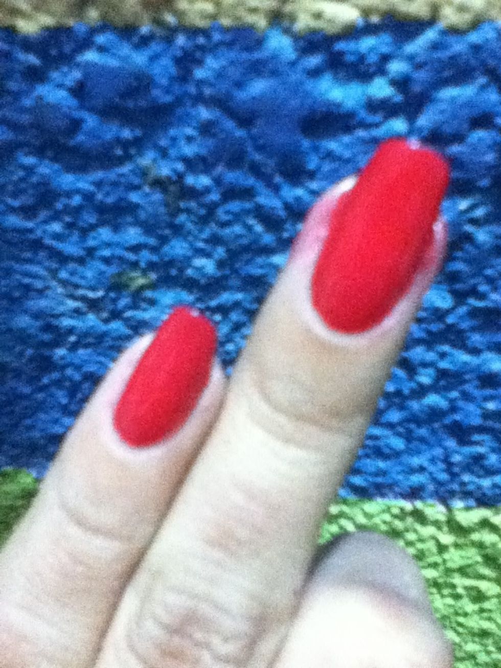 Start with a base coat all over your nails then apply two coats of a red nail polish