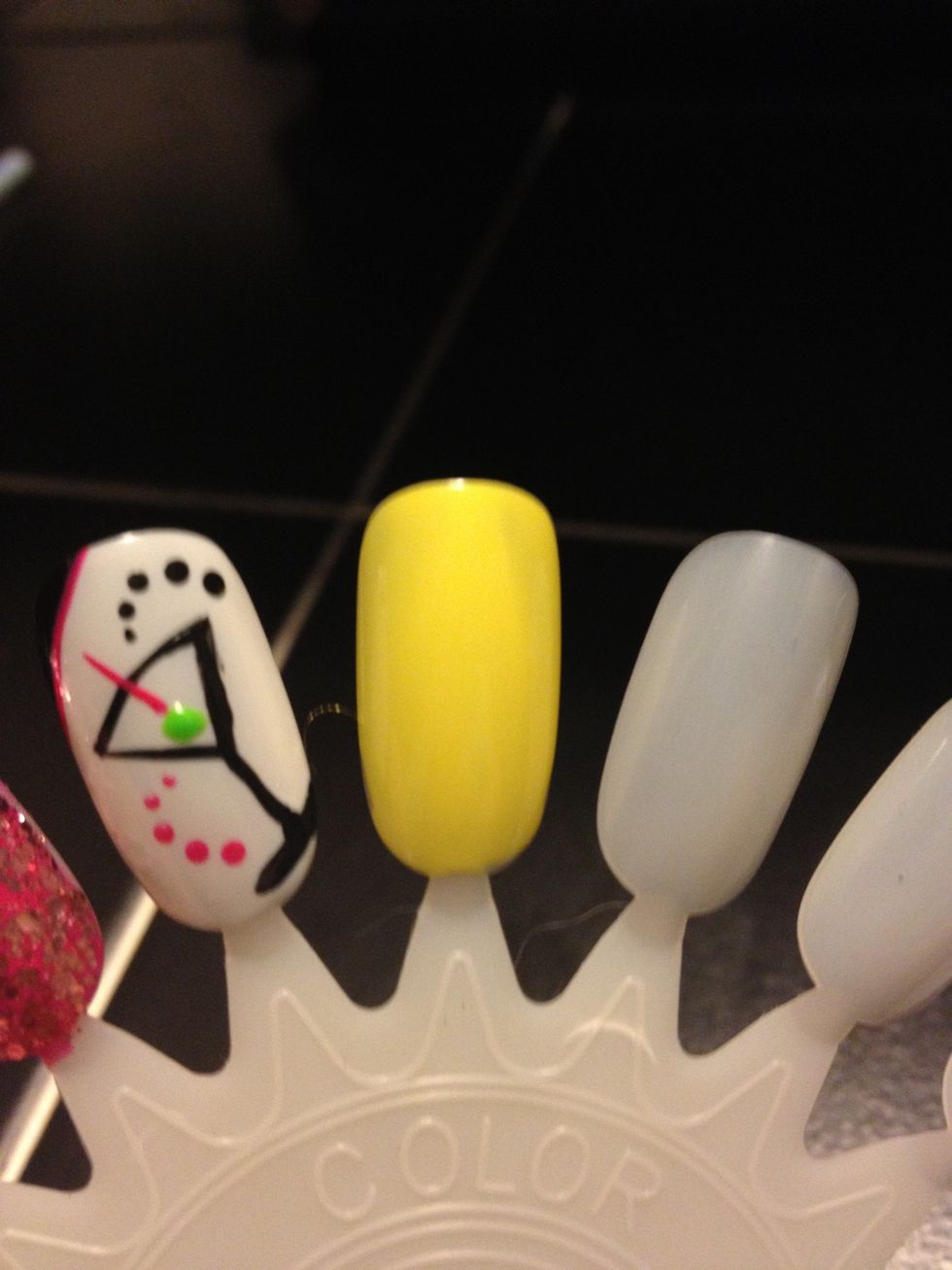 Start with a base coat of any color that you choose. I chose yellow because it really makes the black pop.