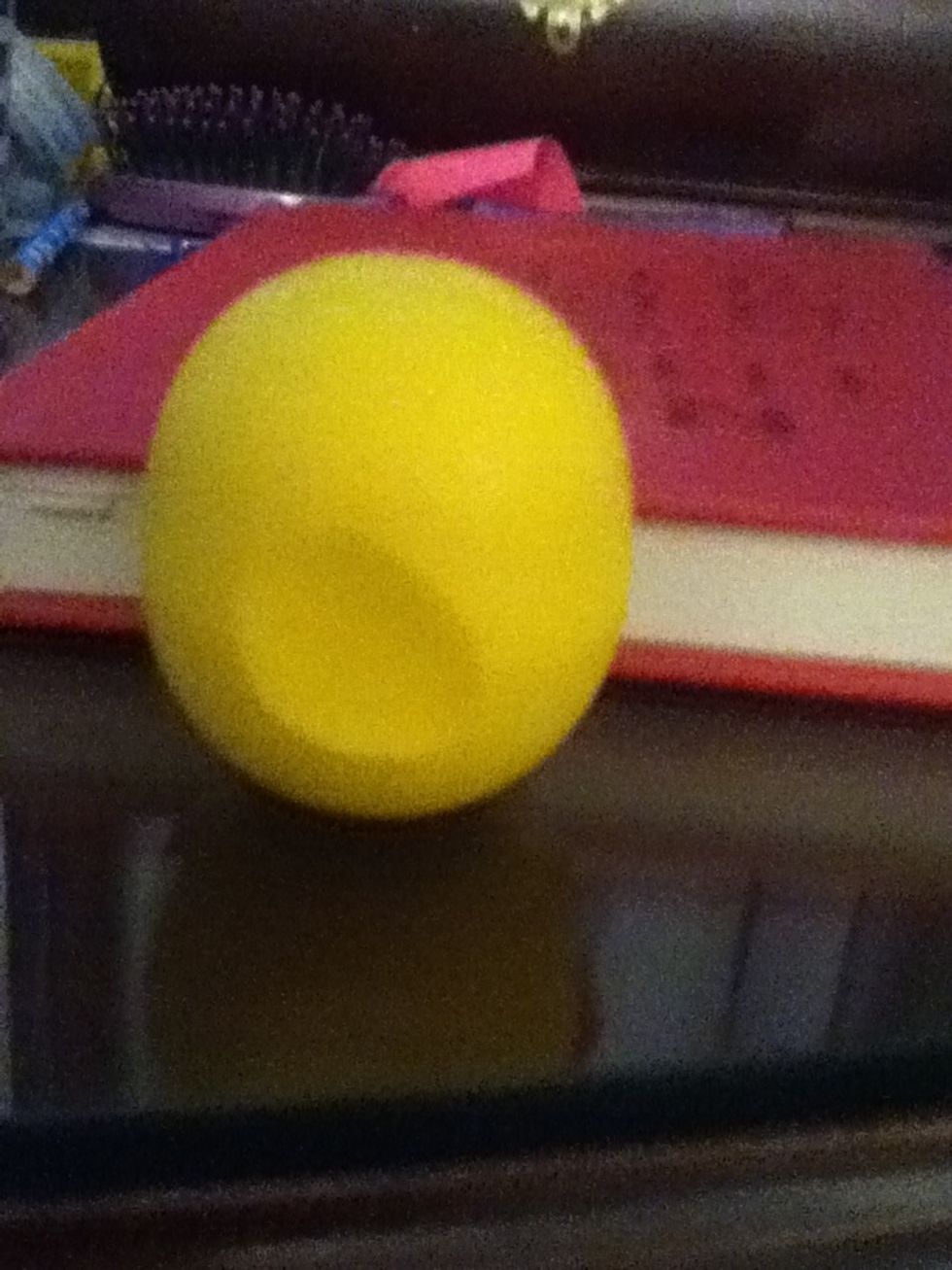 Start with a base, like a clear balm. This is Lemon Drop from EOS.