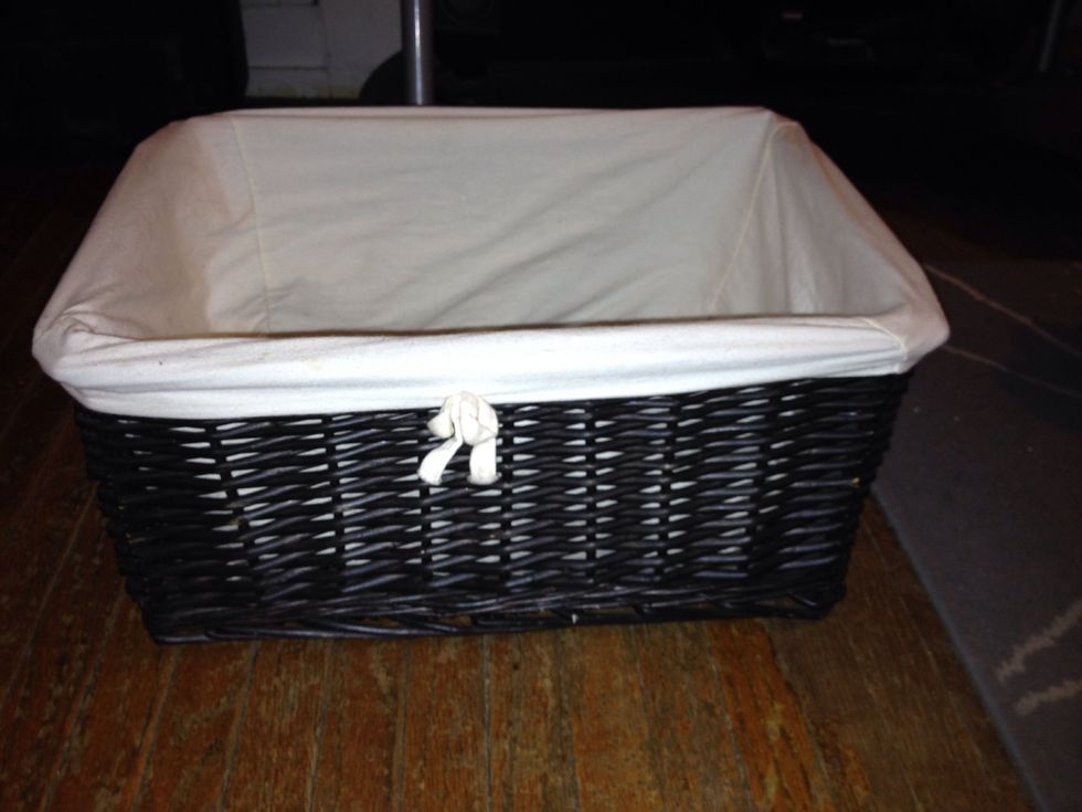 Start with a basket or bin short enough to slide under your bed.