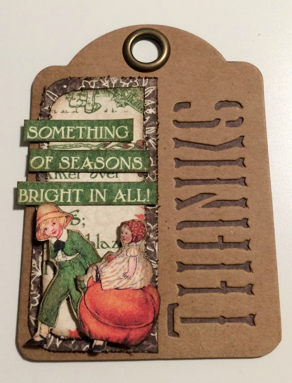 Start with a brown thanks tag, foam square the boy & pumpkin to the bottom of the fall paper. To finish, adhere "Something of the Season" saying above the boy & pumpkin.