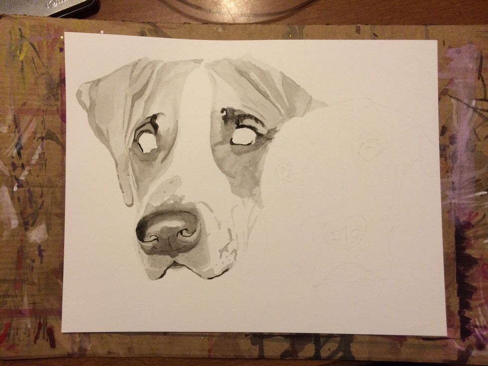 Start with a few drops of black ink inside your paint tray bowl. Then use your brush or dropper to drop some water in a separate bowl. Dip your brush into the black ink and then place into the water.