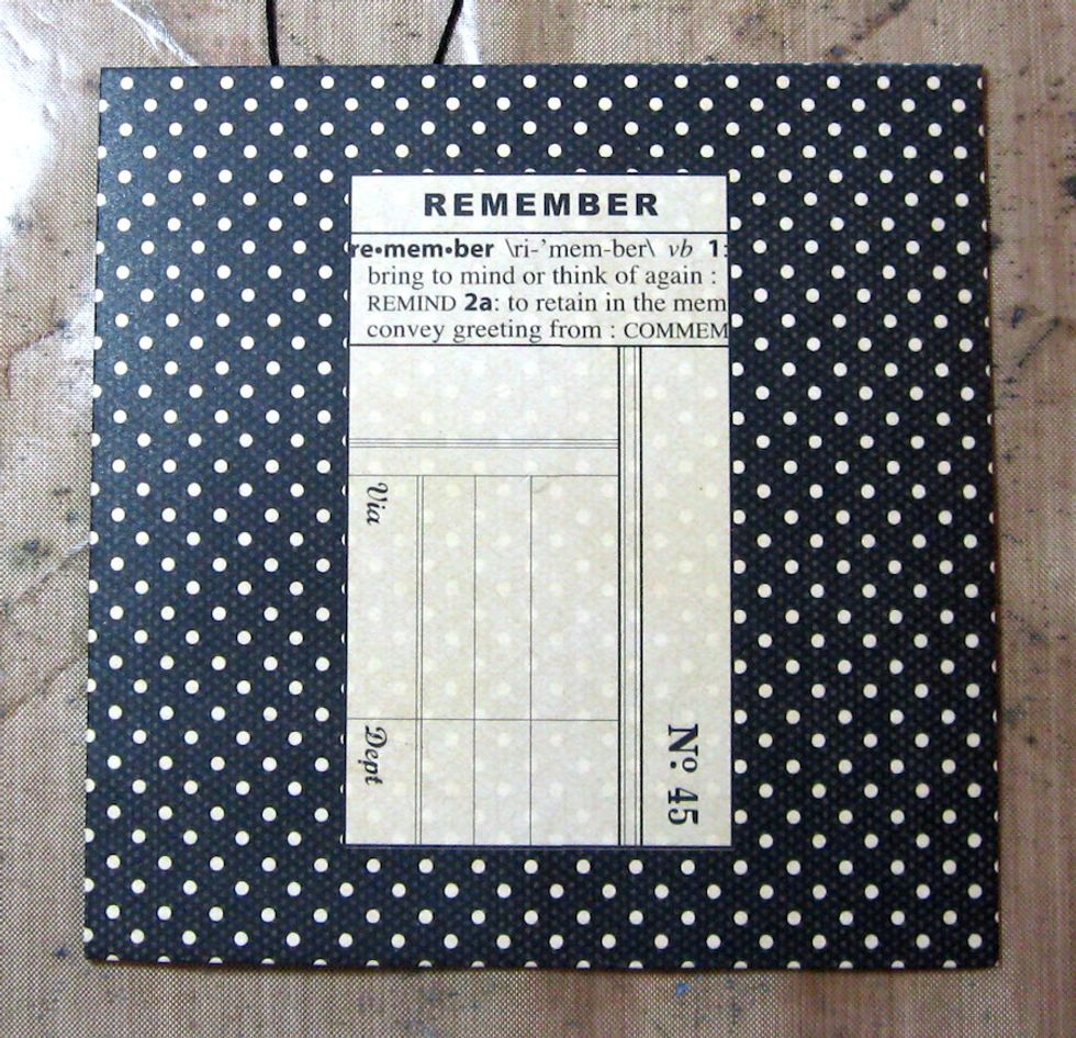 Start with a Graphic 45 Black Square Policy Envelope. We will make both a masculine and a feminine version. Ladies first! NOTE: Ink all cut edges with Vintage Photo Distress Ink.