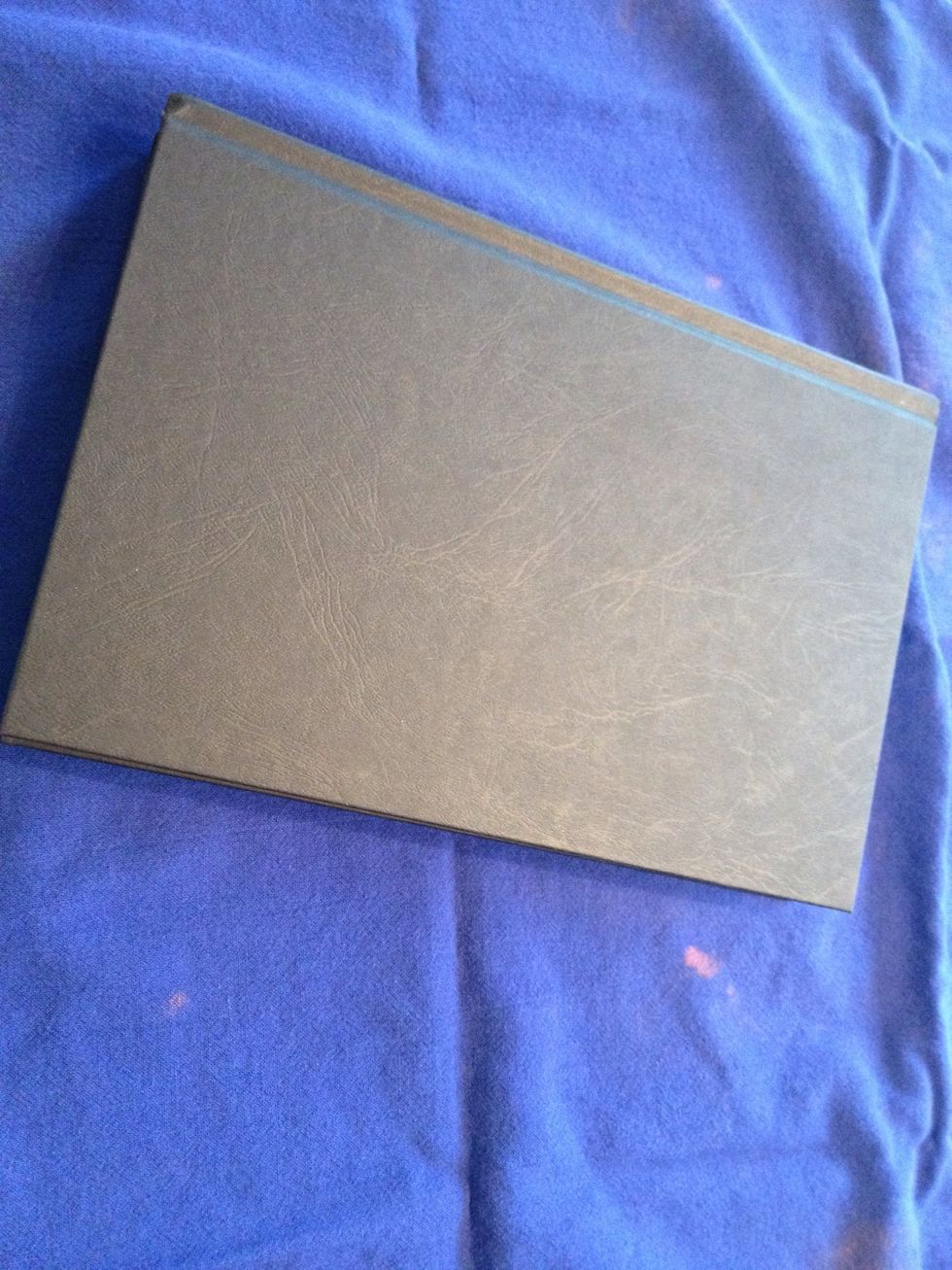 Start with a hardback book that you no longer wish to read. I went to the dollar store and purchased this one for only $1!