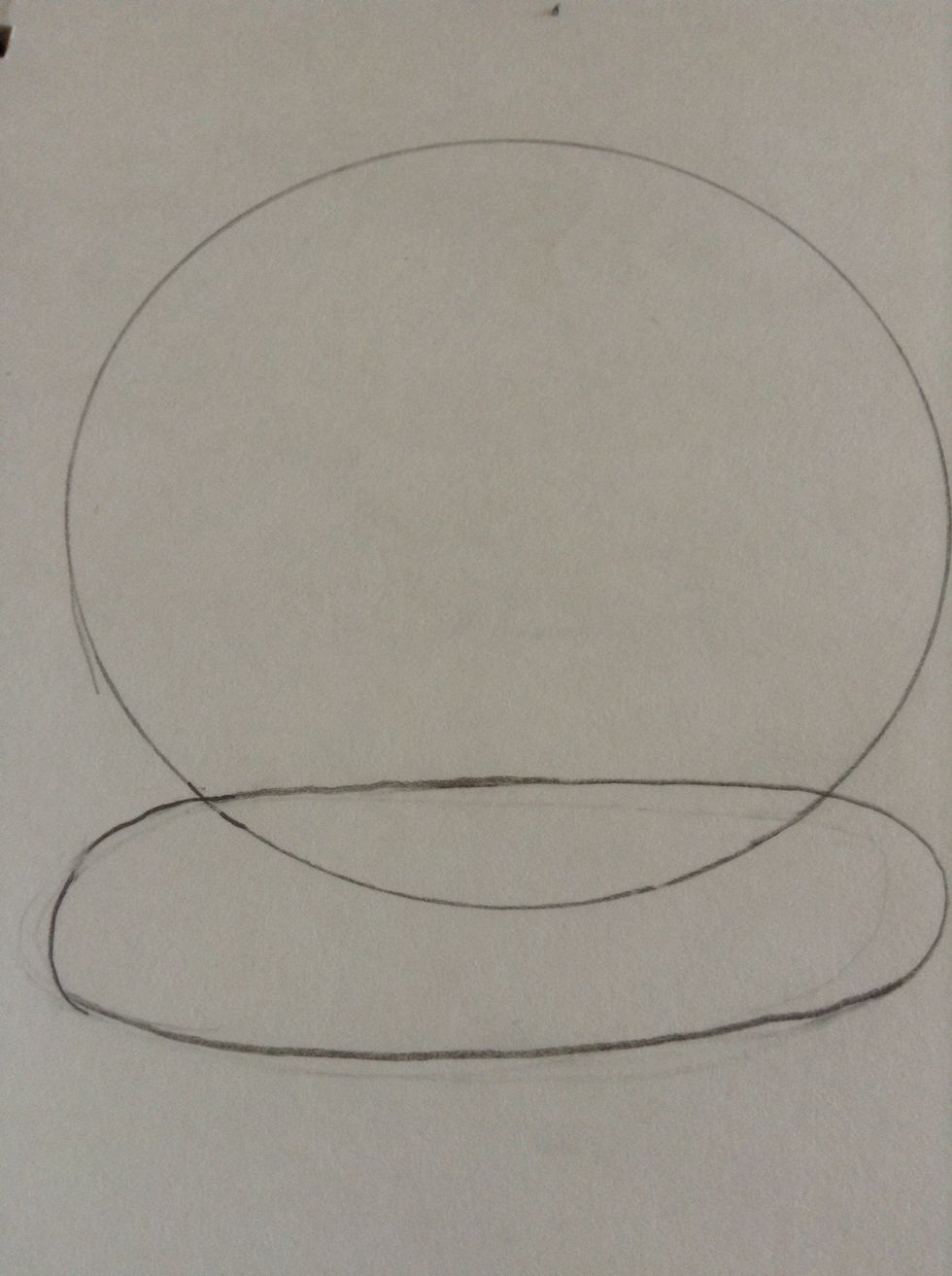 Start with a lightly draw circle and oval.