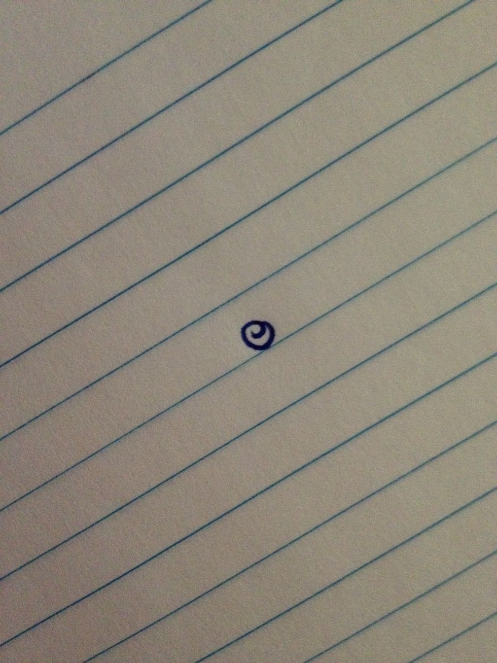 Start with a little swirl. Ink pens work best to define the design more than a regular ballpoint pen.