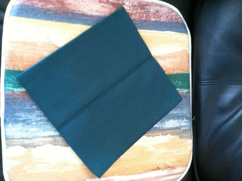 Start with a napkin folded into a square. Make sure that the part with no fold is at the top