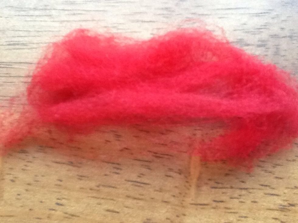 Start with a piece of wool about 2 inches wide and 3 inches long. The amount of wool decides that size of the finished product so use a bigger piece for a large heart ...you get the idea..