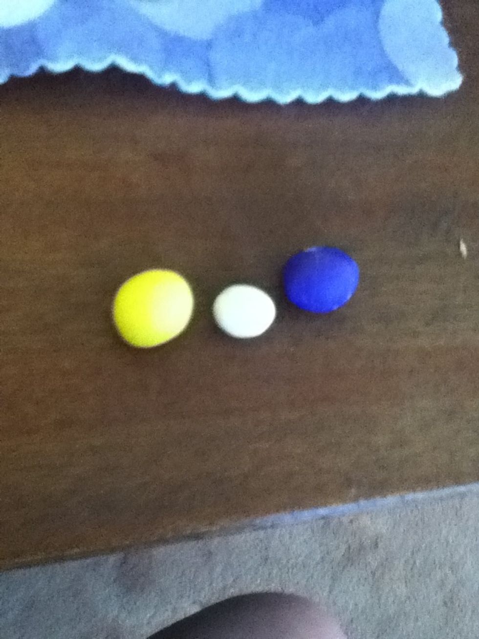 Start with a small ball of yellow , a small ball of purple and a even smaller one of white. Next mix the white and yellow together.