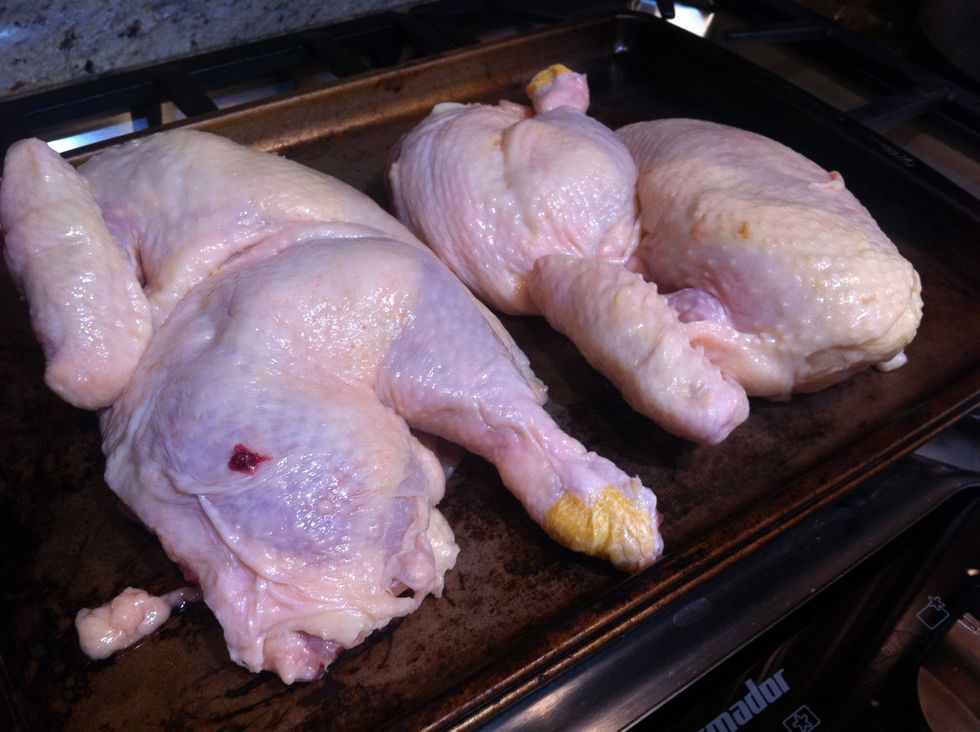 Start with a whole chicken and remove the backbone to give you 2 beautiful halves.. Or buy a chicken already split and save some time, it wont hurt my feelings :)