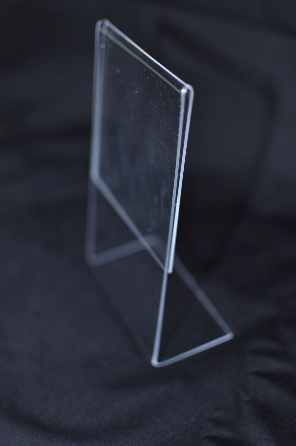 Start with an acrylic photo frame. You can get them from the dollar store. Wipe it down to remove any residue.