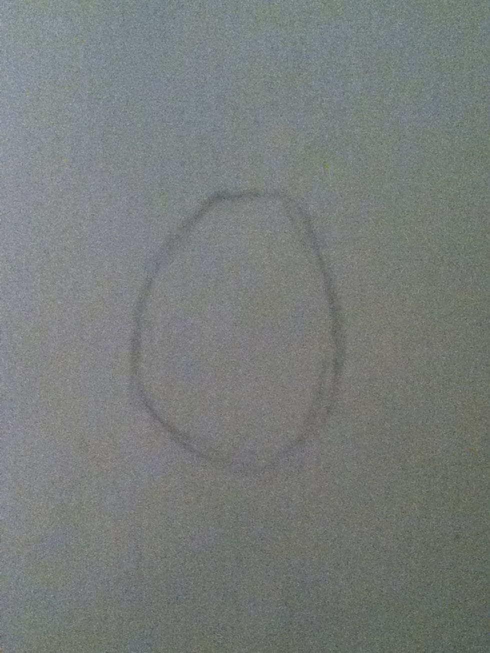 Start with an egg shape for her head, you'll use this to draw her head outline.